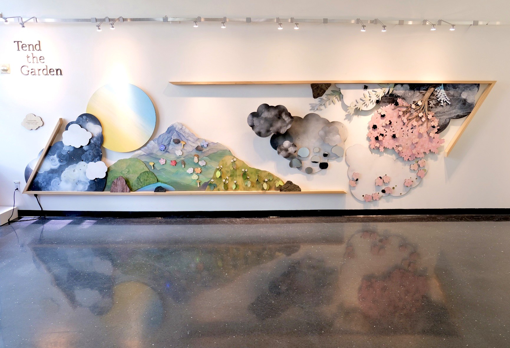 Straight-on view of the hand-painted Tend the Garden installation at Bellevue Arts Museum.